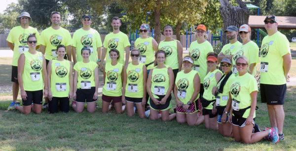 Amazing Race participants pause for a portrait at Sandlot Learning Friday, August 7, 2015. More than $4,000 was raised during the event. (Staff Photo by BONNIE VCULEK)